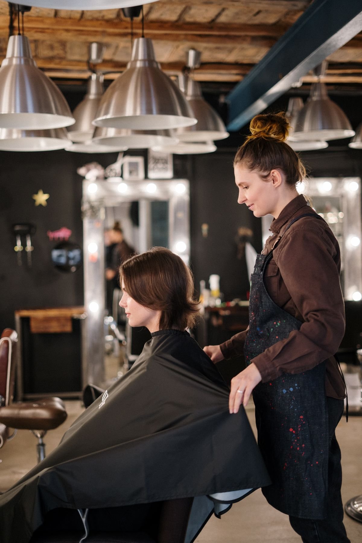 Stylist working with a client in a salon