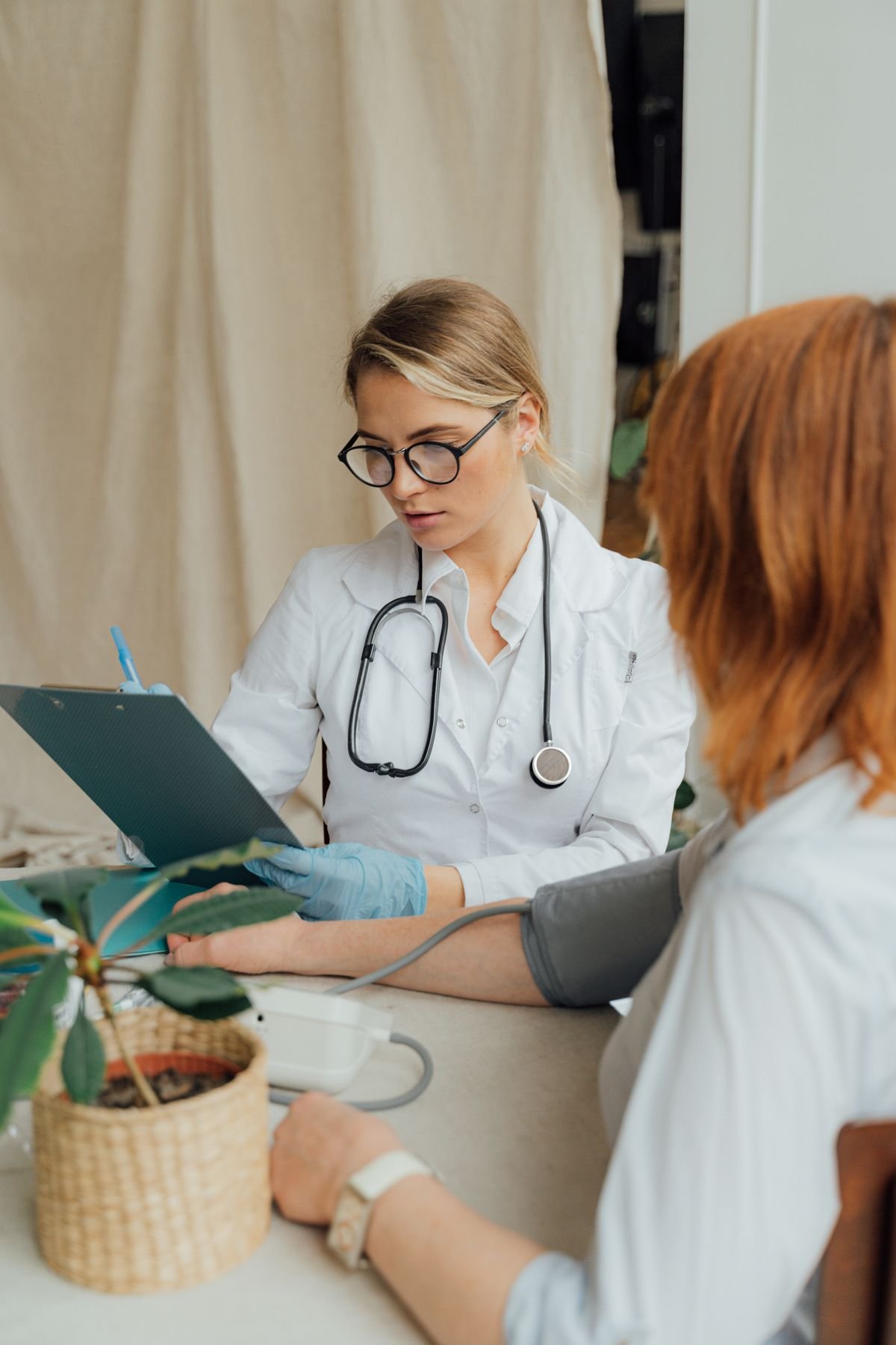 Doctor taking a patient’s blood pressure